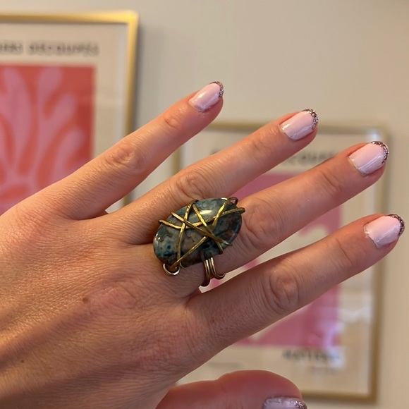 Beautiful blue stone ring wrapped in gold-tone plating. Adjustable ring band. - Picture 1 of 3